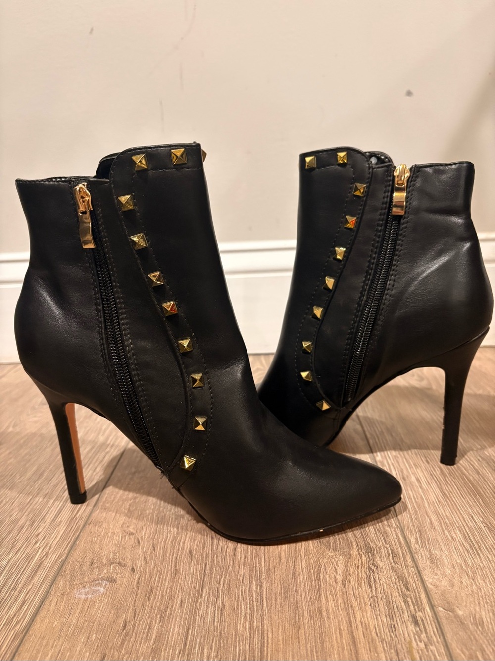 Black Studded Pointed-Toe Ankle Booties with Gold Accents